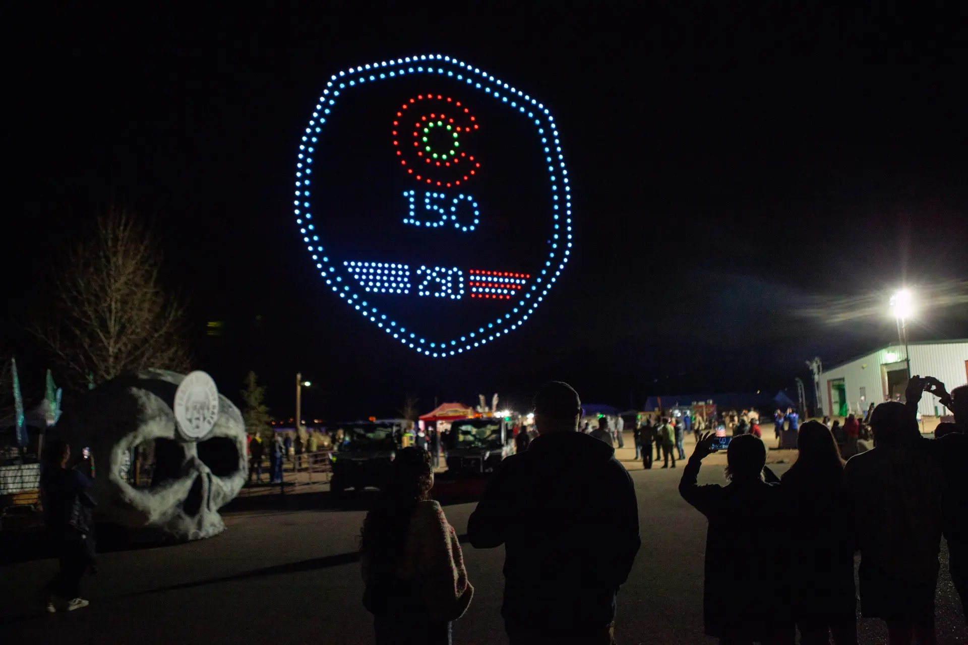A drone show forms a Colorado 150 and America 250 emblem in the night sky over the festival.