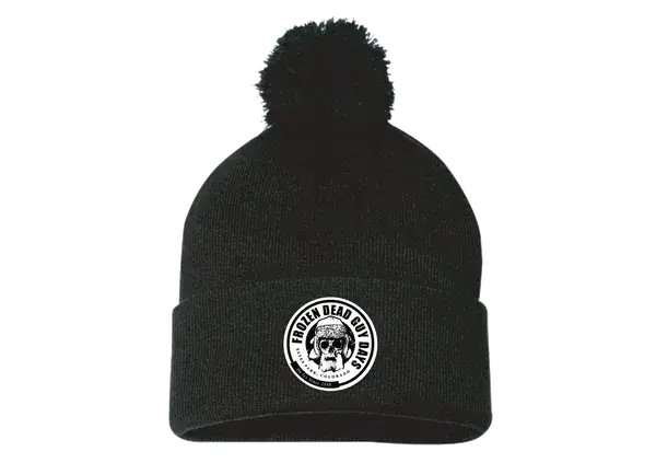 Black pom beanie with the skull badge patch